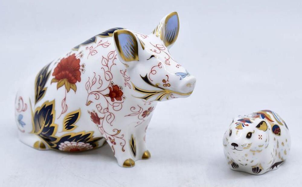Boxed Royal Crown Derby money pig with gold stopper, along with