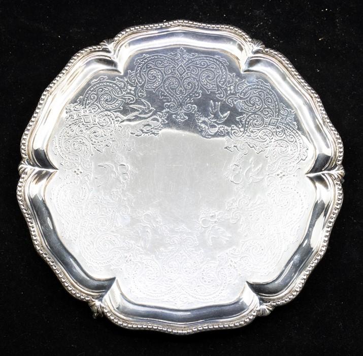 A Victorian silver salver, beaded rim, engraved centre on three ball ...