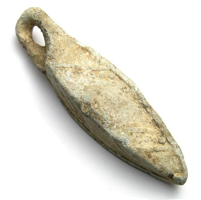 Medieval Fishing Weight. Circa 14th - 15th century AD. Lead, 63.01 grams.  61.61 mm. Lozenge-shaped in section with ribs on each side and a large  suspension loop. An unusual example decorated with