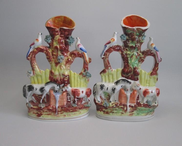 Two Staffordshire Spill groups of a horse and a cow drinking from