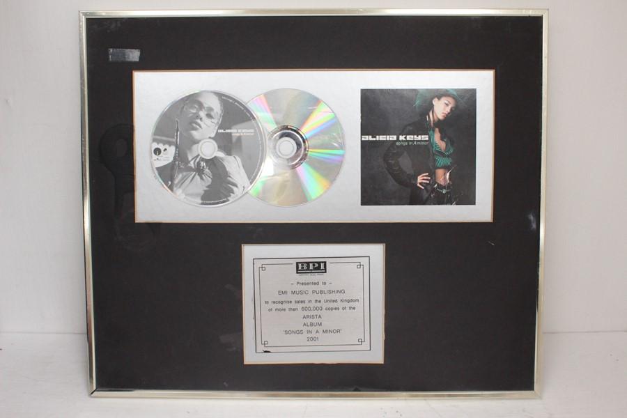 A Framed Disc Award For Alicia Keys Recognising 600 000 Sales For The Album Songs In A Minor No Glass On Frame Price Estimate 30 40