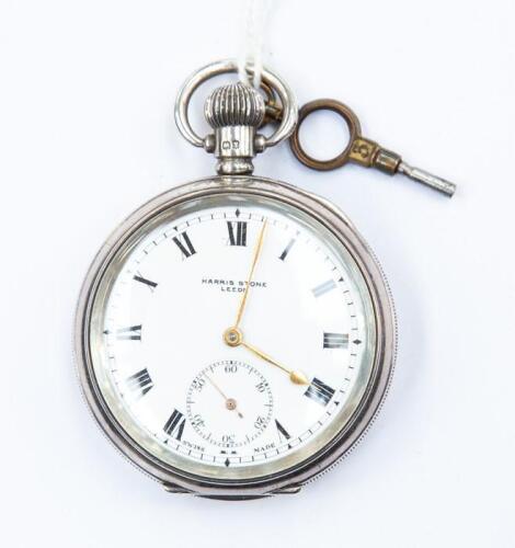 A Harris Stone Leeds, open faced silver pocket watch, white enamel dial ...