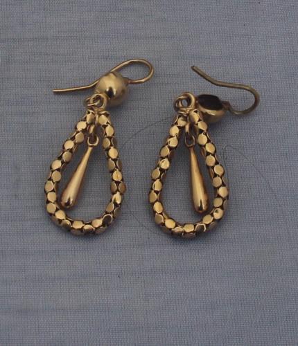 A pair of precious white metal and diamond drop earrings, each having three links set graduated old round cut diamonds suspending inverted stylised horse shoe set old and rose cut diamonds, this in turn suspending further old round cut diamonds, (total diamond weight approx. 2.0 carats), shepherds hook fitting. (gross weight 6.9g)