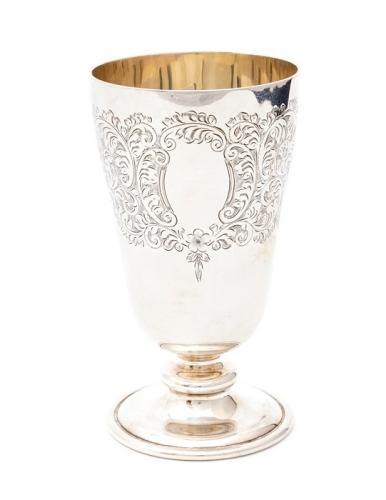 A Victorian style ogee shaped wine goblet, upper section engraved with a band of scrolling foliage, on spreading circular foot, by Charles S Green & Co Ltd, Birmingham, 1966, 6.72 ozt (209.1 grams)