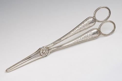 A pair of Victorian silver grape scissors, the stem engraved with foliage, by HJ Lias & Son, London 1873, 2.91 ozt (90.4 grams)