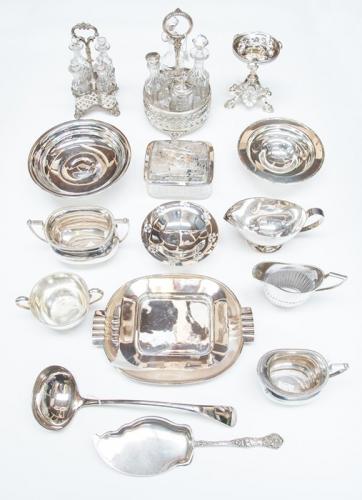 A collection of silver plate including: a circular tazza on detachable stand; an Aesthetic movement glass butter dish the plated cover engraved with ferns beneath a salmon handle; two Georgian style cruet stands each with four glass bottles and stoppers ; an Art Deco serving dish together with a soup ladle, fish server, tea set, sauceboat and three various dishes (1 box)