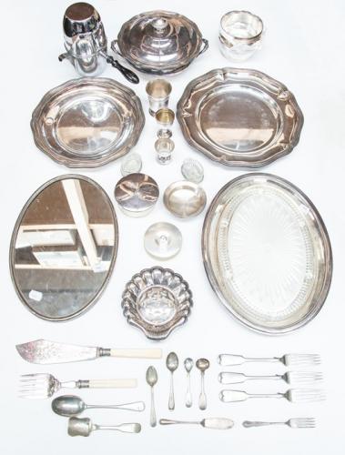 A collection of French mainly 19th Century style silver-plate including two circular serving dishes, a vegetable tureen and cover, a Christofle oval serving dish with moulded glass hor d'oeuvres dish, a silver-plate mounted oval mirror; a set of six finger bowls, a goblet; an egg cup; a set of six liquer tots (boxed) 1 box