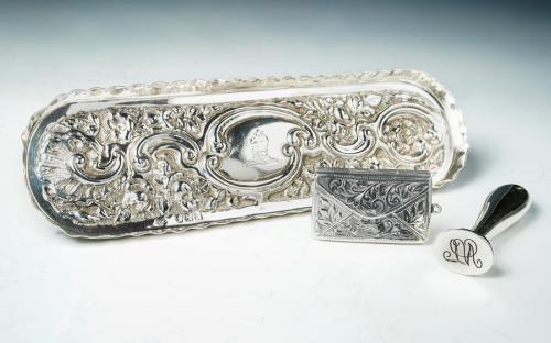 A collection of silver including a Victorian pen tray, London 1896; a seal, Birmingham 1911, Henry Williamson; and a double stamp case shaped as an envelope, London? (3)