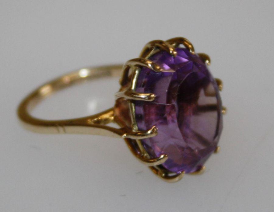 A 9k amethyst ring, claw set large oval cut amethyst, hallmarked ...