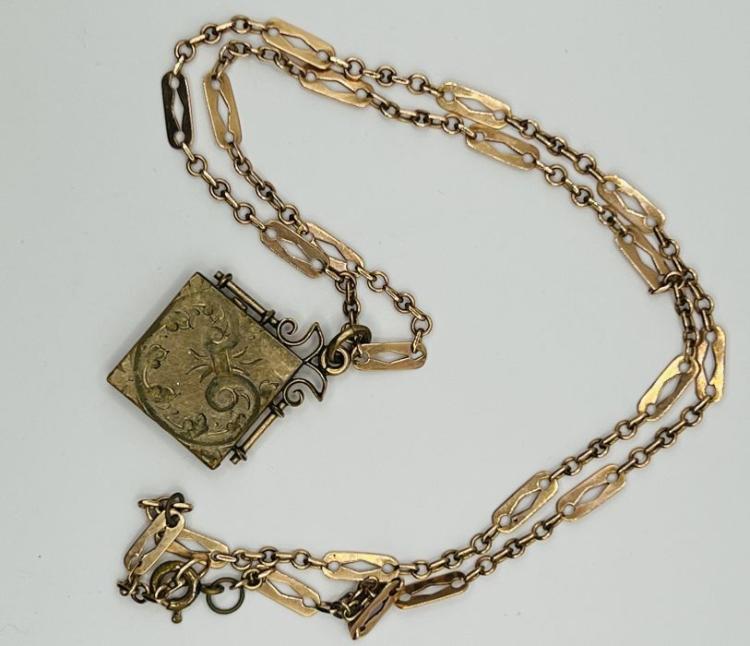 Unusual square shaped locket on razor blade style chain, containing ...