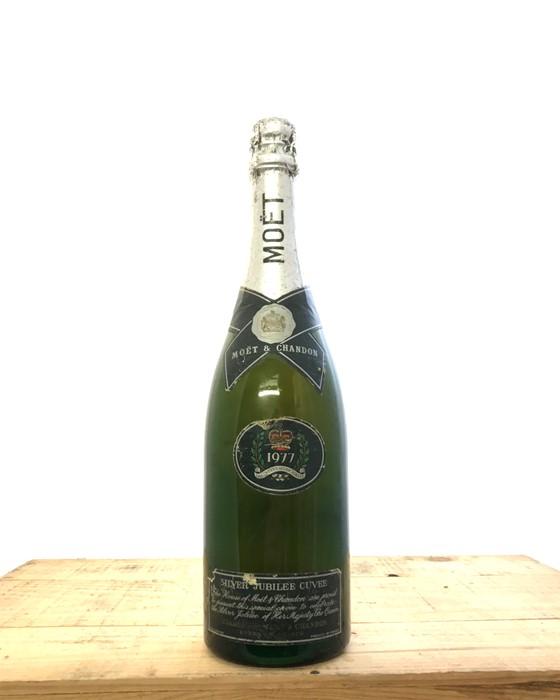 A bottle of 1977 Moet & Chandon champagne to celebrate Queen Elizabeth II's  Silver Jubilee. Description: Quantity: 1 bottle. Condition: Good. Origin:  Private individual Type of cellar: N/A Original Wooden Case: N/A