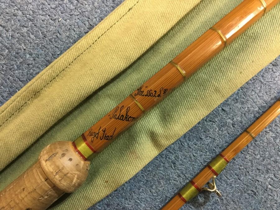 Angling interest: Hardy Palakona No 2 two peice split cane 9 1/2 foot RH  spinning rod. Complete with House of Hardy marked canvas cover.