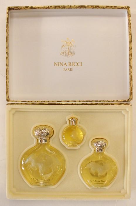 A Nina Ricci of Paris perfume set L Air Du Temps comprising 3 bottles designed by Lalique complete in original presentation box made exclusively by Boots