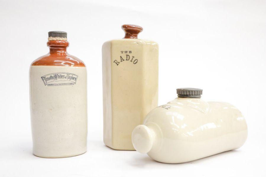 Three Lovatt Langley ware pottery hot water bottles, one inscribed
