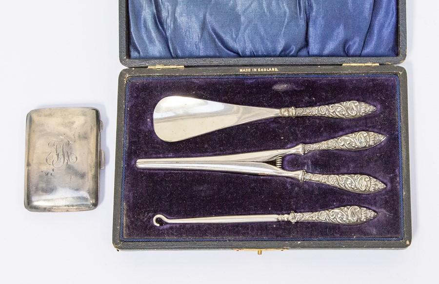 A silver ladies button hook, shoe horn, glove stretcher set boxed along  with a silver cigarette case (1 bag)