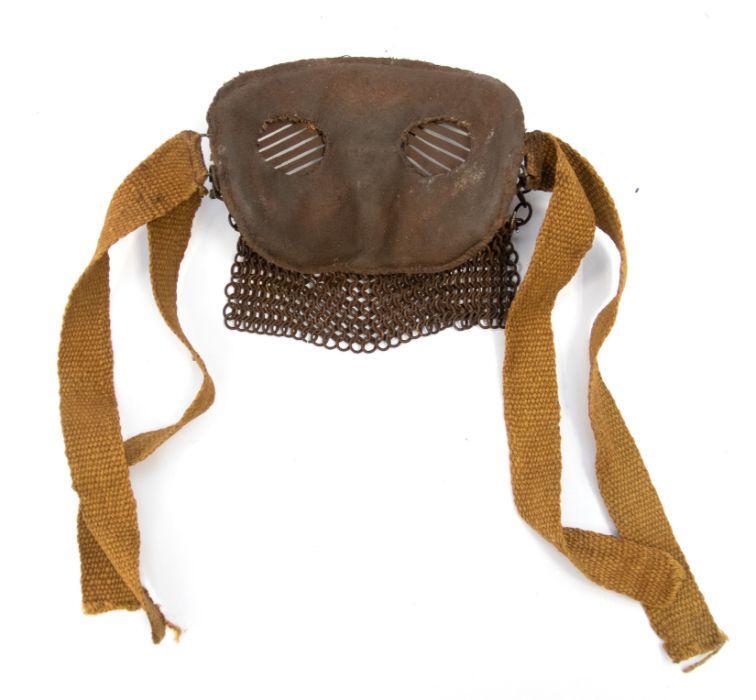 A World War I tank crew splatter mask, with a chain mail mouth guard ...
