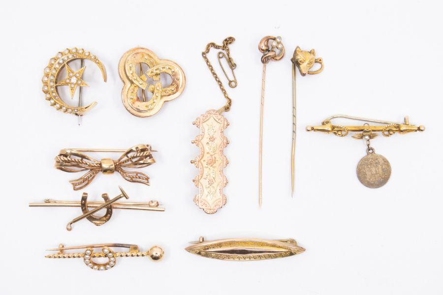 A collection of early 20th century gold brooches, to include an diamond and  pearl 18ct gold crescent moon and star brooch, size approx 23mm, later base  pin, total gross weight approx 4.3gms