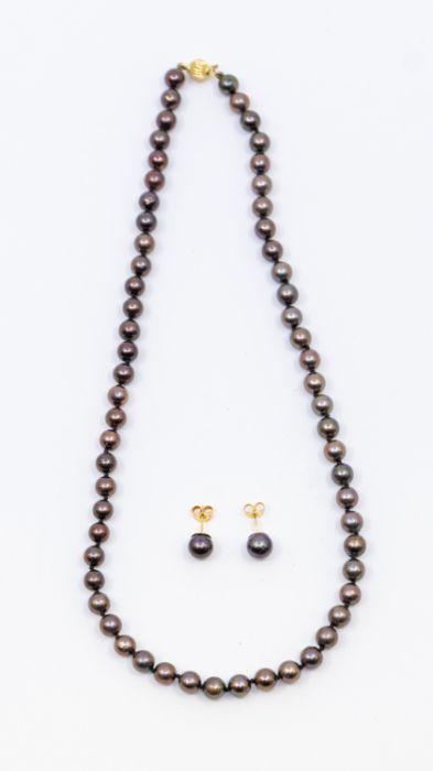 A Beaverbrook's jewellery set consisting of black cultured pearl necklace,  each pearl approx 5mm, strung knotted, on an 18ct gold ball clasp, length  approx 16'', along with a matching pair of stud