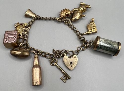 Lot 120 - A 9ct gold charm bracelet