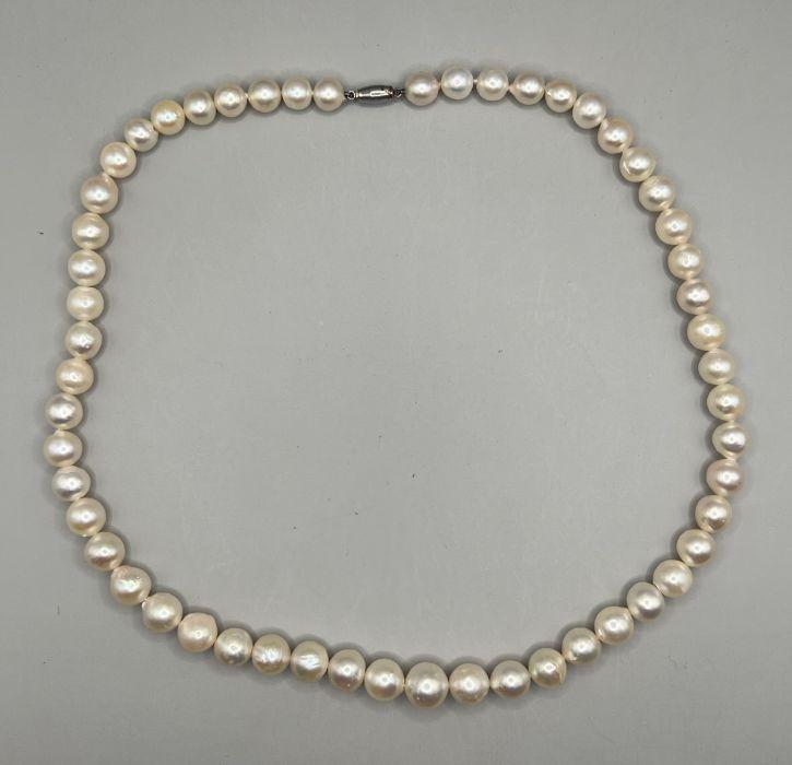 A strand of graduated cultured pearls by Ciro with a clasp stamped