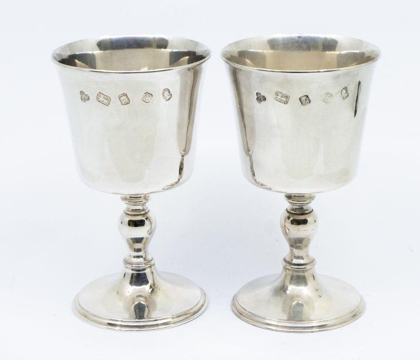 A pair of Elizabeth II silver wine goblets, with circular pedestal base ...