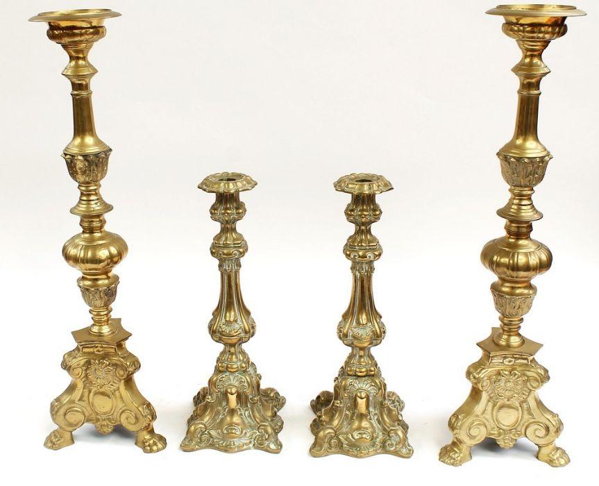 Lot - SET OF FOUR GEORGIAN BRASS PUSH-UP CANDLESTICKS