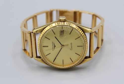 A gentleman s Longines wristwatch with yellow metal bracelet