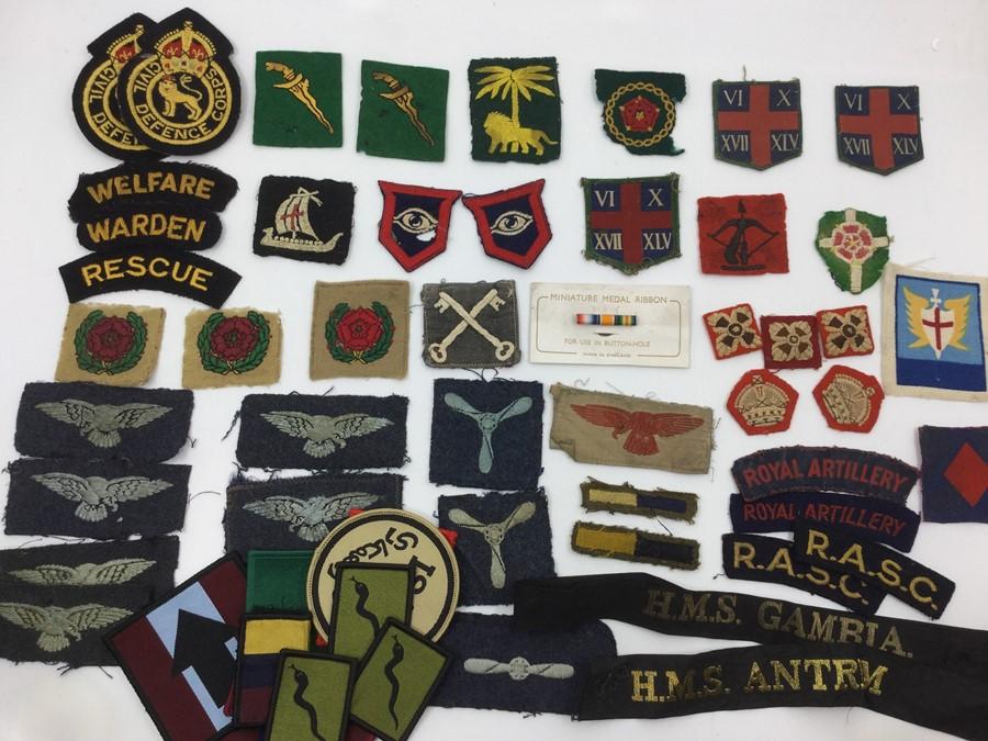 A collection of WW2 British and later 1950's formation signs, rank ...