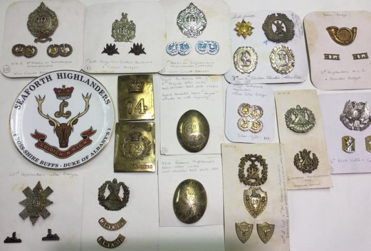 A collection of restrike Scottish Regimental cap badges and collar dogs ...