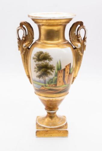 A Continental porcelain urn vase painted with tavern scene to one side and scenery to other, on square base, gilt decoration.
 Approx. 27.5cm high.
 Further Details: Screwed but slightly loose from base, some loss to gilding, general wear.