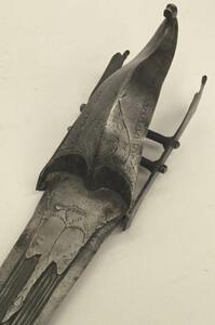 A 17th century Indian Katar from the Vijayanagara Empire.
 Multi fullered double edged blade.
 Reinforcing plates from the ricasso to both sides of the blade, both of which appears represent a bird of prey,
 Curled sail shaped hand guard with chased decor - 9