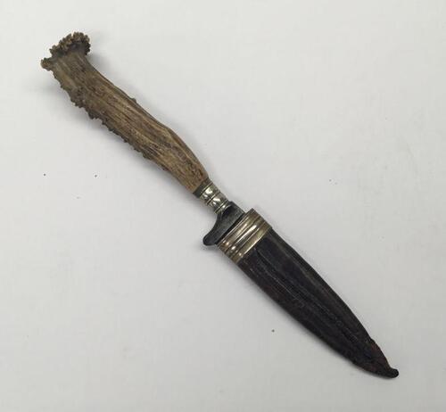 A late 19th / early 20th century German made sheath knife.
 Antler handle with silver plated mounts.
 Steel single edged blade, marked ‘Solingen’.
 Polished leather sheath with silver plate throat mount.
 Approximately 21cm length when in scabbard.
 Condi