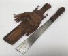 A mid 20th century or earlier, Kenyan Mau Mau machete knife.
 Single edge steel blade with squared off end section.
 Leather covered handle with further painted leather strip grips applied around the circumference.
 Accompanied by a broad leather sheath o - 5