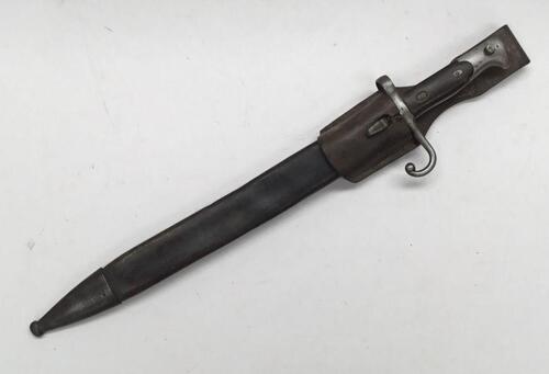 A 19th century Italian M1870 1st pattern Vetterli bayonet, with associated scabbard and leather frog.
 Wooden slab grips, with steel pommel, cross guard and quillon.
 Single edged blade with fuller to both sides, marked ‘RS’ and ‘Terni’ at the ricasso.
 T