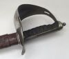 An 1897 pattern WW1 era British infantry officers sword, with unusual non pieced guard.
 Steel guard with nickel plating, with engraved crown and cypher of George V.
 Shagreen grip with wire binding, chequered backpiece, and knopped finial.
 Leather washe - 3