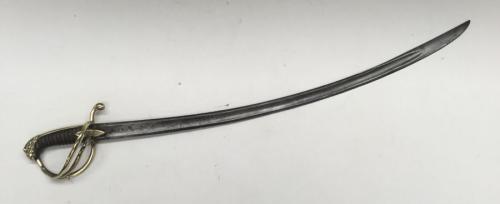 A 19th century cavalry sabre, likely French in origin.
 Brass 3 bar guard, with brass quillon, backpiece, and lions head pommel.
 Leather bound grip with twisted wire bindings, plus navette shaped langets to both sides.
 Curved single edged blade with false edge towards the tip, a flat spine, and shallow single fuller.
 Approximately 100cm total length - blade length 86cm.
 Condition: generally good, with some service wear.
 Some light knock and darkening to the brass on the hilt.
 Leather bound