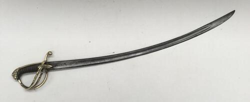 A 19th century cavalry sabre, likely French in origin.
 Brass 3 bar guard, with brass quillon, backpiece, and lions head pommel.
 Leather bound grip with twisted wire bindings, plus navette shaped langets to both sides.
 Curved single edged blade with fal