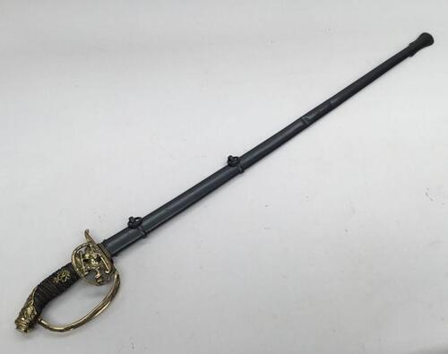 M1889 Prussian infantry officers sword.
 Brass fold down guard, with Imperial Eagle set with WRII on its chest.
 Highly decorated pommel, with oakleaves, another eagle and swords.
 Fish skin grip with twisted wire binding, and another brass WRII monogram 