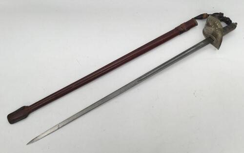 A WW1 era 1897 pattern infantry officers sword, with scabbard, by Fenton Brothers of Sheffield.
 Nickel plated pierced guard, George V cypher and crown.
 Fish skin grip with twisted wire binding, plus chequered backpiece.
 Steel single edged blade with si