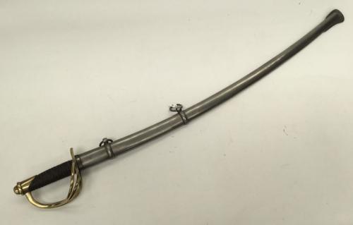 U.S. Civil War era M1860/M1862 cavalry troopers sword by MFG Co of Chicopee, Massachusetts.
 Brass 3 bar guard and pommel, with stamped serial number 14506.
 Leather bound grip with twisted copper wire binding.
 Single edged curved blade with flat spine and single fuller.
 Makers marks and 1862 date to the ricasso.
 Complete with polished steel scabbard with two suspension rings.
 Approximately 106cm - blade length 86cm.
 Condition: very good.
 Clean condition all round, very small amount of mov