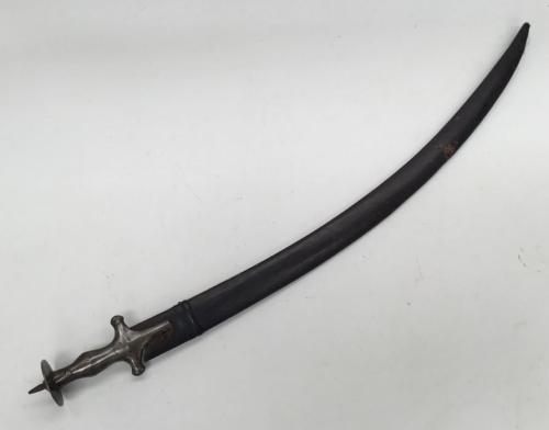 A late 19th / early 20th Indian talwar sword and scabbard.
 Of traditional form, all steel construction, with contoured handle, convex quillon, and disc shaped pommel with spike finial.
 Curved single edge blade with flat spine.
 Complete with leather covered scabbard.
 No apparent makers marks.
 Approximately 91cm in scabbard.
 Condition: generally good.
 Some darkening and pitting to the steel parts, plus very minor corrosive spotting.
 The leather scabbard is complete, but there is a split to