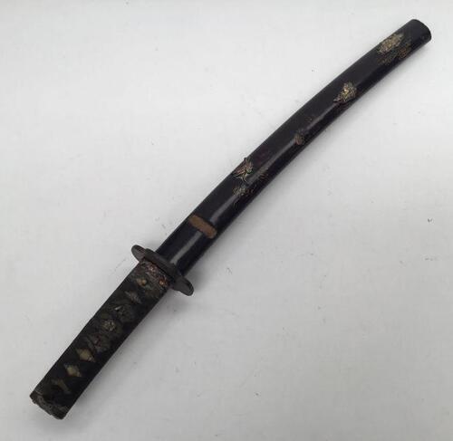 A Japanese Wakizashi short sword.
 Cord Tsuka hilt binding over a ray skin handle, with gilt Menuki ornament to both sides.
 Iron Tsuba with simple chased foliage decoration.
 Copper Sepoa and Habaki.
 Copper Fuchi with flower decoration that matches the 