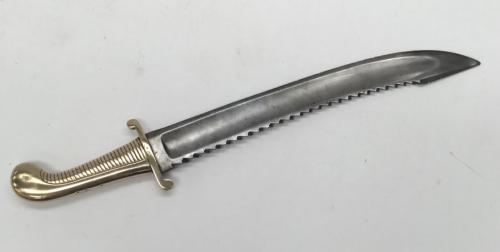 A scarce M1827 Imperial Russian sawback falchion heavy pioneer’s sword.
 Heavy weight brass handle with ribbed grip section, curled quillons, plain backpiece, and a curved pommel.
 Wide steel, slightly curved blade with large toothed sawback edge, plus a regular cutting edge.
 Single fuller with blunted tip.
 Dated 1832 to the brass cross guard, plus BH and AC, and a Russian Cyrillic mark to the blade near the ricasso.
 Approximately 66cm length.
 Condition: generally good.
 Some service wear to