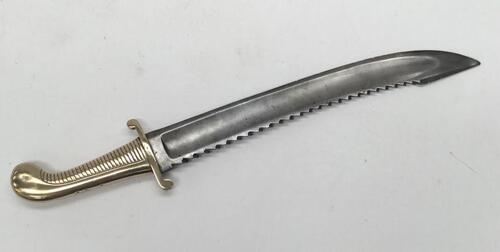 A scarce M1827 Imperial Russian sawback falchion heavy pioneer’s sword.
 Heavy weight brass handle with ribbed grip section, curled quillons, plain backpiece, and a curved pommel.
 Wide steel, slightly curved blade with large toothed sawback edge, plus a 