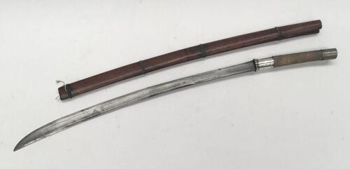 A 19th century Burmese Sword (Dha).
 Fish skin grip with nickel pommel and white metal / silver guard.
 Steel slightly curved single edge blade, 2 very short fullers to both sides, plus some simple chased decoration from the ricasso upwards.
 Polished woo