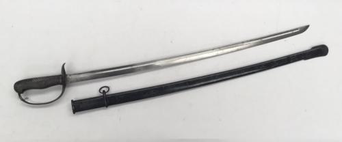 A scarce Japanese M1889 Type 32 NCO’s sword Otsu.
 Steel guard with chequered backpiece and chequered wooden grip.
 Slot to hilt near the pommel to allow the fitting of a sword knot.
 Blade release catch fitted to the handle.
 Steel, slightly curved single edged blade with flat spine and single fuller - the tip of the blade being of katana style.
 Serial number stamped to the ricasso, but no apparent number marked to the scabbard.
 Scabbard of steel construction, with single single suspension ri