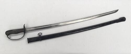 A scarce Japanese M1889 Type 32 NCO’s sword Otsu.
 Steel guard with chequered backpiece and chequered wooden grip.
 Slot to hilt near the pommel to allow the fitting of a sword knot.
 Blade release catch fitted to the handle.
 Steel, slightly curved singl