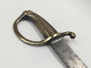 French 1816 pattern briquet short sword.
 Ribbed grip brass grip, with D shaped knuckle guard and curled quillon.
 Single edged slightly curved un-fullered blade with flat spine.
 No apparent issue marks or makers marks to be found.
 Approximately 73cm le - 5