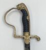 A WW2 era German army officer’s sword.
 Cast cross guard with German eagle set into the langet.
 D shaped knuckle guard with oak leaf detail, lions head pommel, and backpiece decorated with scrolls and flowers.
 Black celluloid grip with twisted wire bind - 2