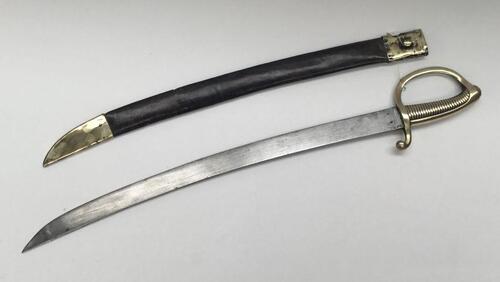 An early 19th century French 1817 pattern Sabre Briquet.
 German made blade, stamped Klingenthal to the spine.
 Cast brass handle, with D shaped knuckle guard, 28 ribbed grip, and curled over quillon.
 Slightly curved steel singled edged blade, un-fullere